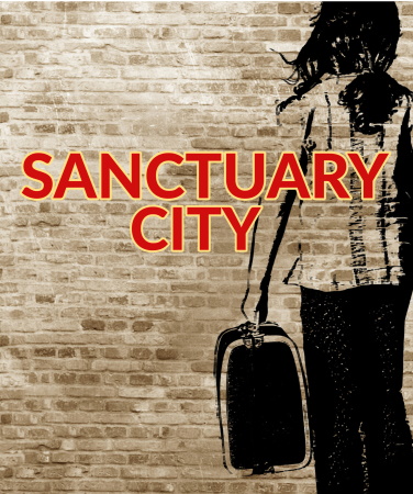 A light-colored brick wall with the shape of a person with a suitcase sketched on the wall for the play Sanctuary City for TRW Plays